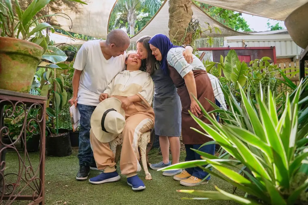 Disabled friends having a group hug